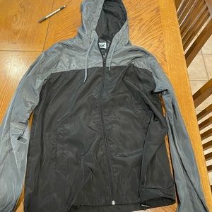 Grey and black “beautiful giant” raincoat